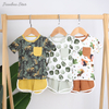 Top vente nouveau Design de haute qualité 100% coton confortable Style d'été décontracté à manches courtes bébé costume bébé vêtements avec poche