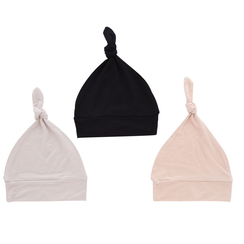 Chapeaux de bébé en gros tissu de bambou couleur unie douce décoration faciale OEM chapeaux de bébé unisexes personnalisés pour toutes les saisons