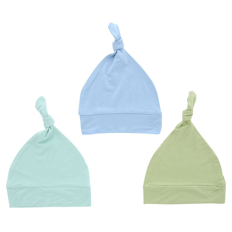 Chapeaux de bébé en gros tissu de bambou couleur unie douce décoration faciale OEM chapeaux de bébé unisexes personnalisés pour toutes les saisons
