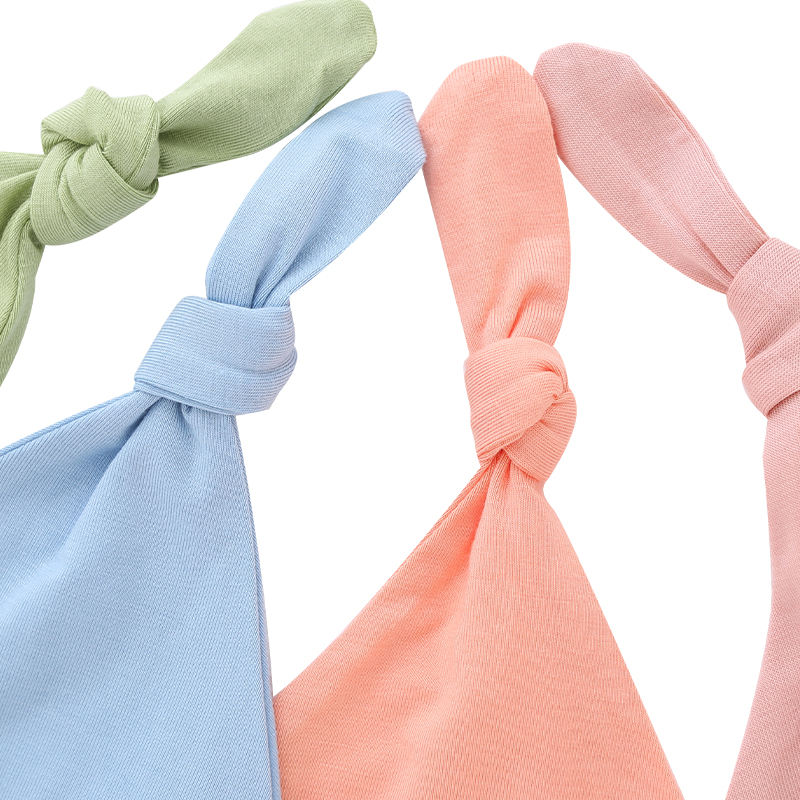Chapeaux de bébé en gros tissu de bambou couleur unie douce décoration faciale OEM chapeaux de bébé unisexes personnalisés pour toutes les saisons